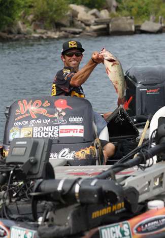 Elite pro Michael Iaconelli holds up a fat daddy before placing it into the transport bag.