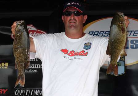 Dana Perrotte holds up two smallmouth bass that helped him to an early lead.