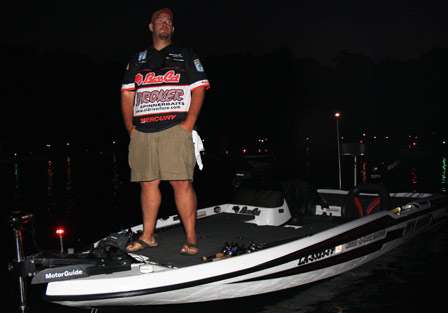 Pro Chris Burnham looks up the hill for his co-angler as he makes his way to the dock.