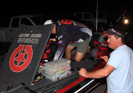 Russell Parrish and Jason bass prepare their equipment in the parking lot of the Umphrey's Family Pavilion prior to launch of Day Two of the Central Open on Sam Rayburn Reservoir.