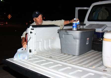 Bobby Harrell loads water into a cooler as he waits for his co-angler for Day Two of the Bassmaster Central Open.