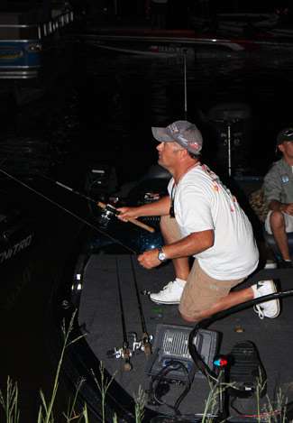 Chris McCall prepares his rods and reels in the early morning hours before the official Day Two launch.