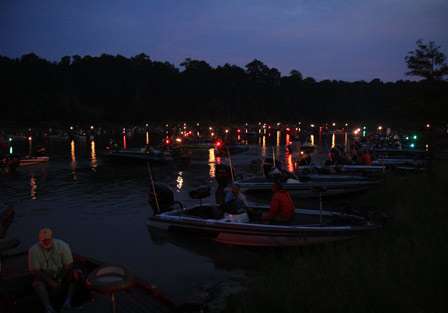 The skies begin to brighten as the field of 193 boats gather in the cove at Umphrey's Pavilion.