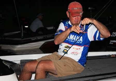 Elite pro Clark Rheem takes the time to re-tie a bait before the official launch on Day Two.