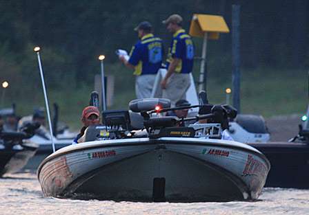 Bassmaster Elite Series pro Clark Reehm idles away from the inspection dock and out toward the open water.