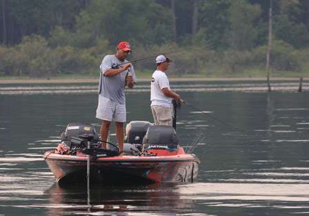 Elite pro Matt Reed removes the hook from a bass that doesn't make the 14 inch length limit on Sam Rayburn.