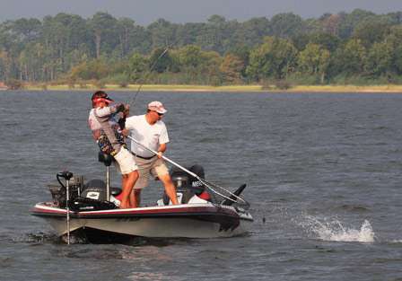 It's not long before pro Stephen Johnston is hooked up and his co-angler David Cooper is working the net. 