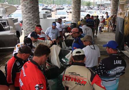 Competitors start to stack up on both sides of the tanks behind the Bassmaster stage.