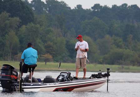 Elite pro Bradley Hallman swings a short bass into his boat that fell for a topwater bait.