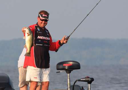 Johnston is all smiles as he knows this fish will replace a much smaller bass in his livewell.