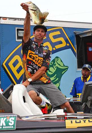 Mike Iaconelli holds up the biggest bass of the day, a 4-pound, 11-ounce mule.