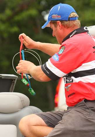Kelly Jordon sorts out his culling tabs before his fish are bagged and brought to the scales.
