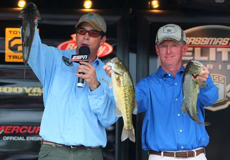 BASS emcee Keith Alan and BASS Tournament Director Trip Weldon hold the fish caught by Mark Menendez. Menendez had to leave the lake early because of a family emergency. 