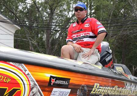 Cliff Pace sits in his boat before being pulled out to the Bassmaster stage.