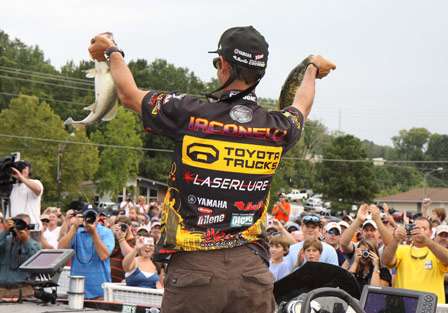 Iaconelli shows off two pigs as the crowd goes wild with Iaconelli fever.