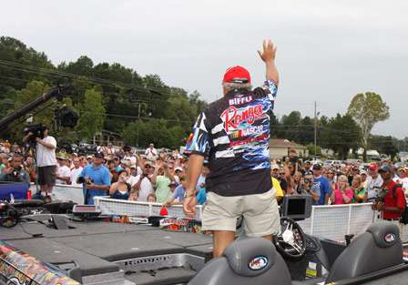 After his introduction, Elite pro Tommy Biffle stands and waves to the large crowd outside the Civic Center in Wetumpka.