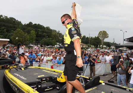 Elite pro Skeet Reese shows his limit of fish to the crowd before taking the stage.