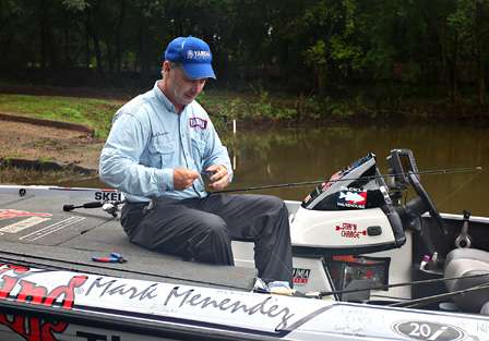 Menendez took his time at the ramp, preparing his fishing tackle before moving out to the main river channel. 