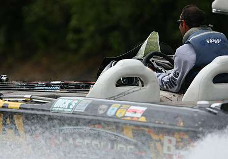 Mike Iaconelli speeds down the Alabama River with a map at the ready. 