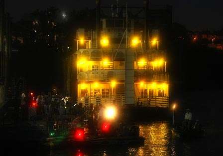 The riverboat Harriot II lit the morning for the anglers and the spectators there to watch takeoff.