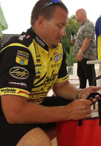 Elite pro, and current TTBAOY points leader Skeet Reese, listens back stage as Kevin VanDam takes the lead in the tournament, tightening the gap in the points race.