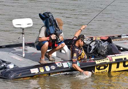 Iaconelli makes a quick grab as his fifth fish gets close to the boat.
