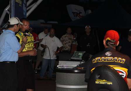 Skeet Reese takes the stage as Kevin VanDam sits in the 