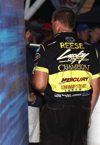 After congratulating Kevin VanDam, Skeet Reese leaves the stage.