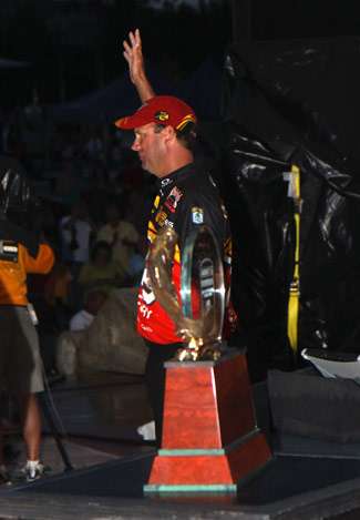 Elite pro Kevin VanDam waves to the crowd as he is announced the Toyota Tundra Bassmaster Angler of the Year.