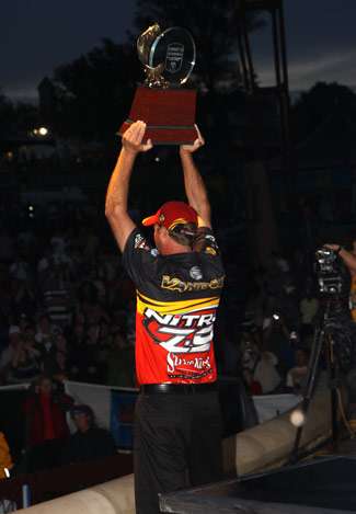 Kevin VanDam hoists the Angler of the Year trophy for the fifth time in his career.