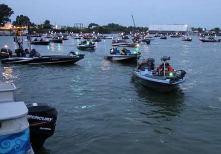 The first flight of boats make their way out of the crowd and start the inspection process before taking to Lake Erie.