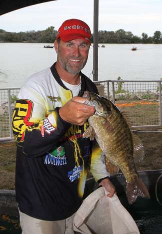 Pro Brandon Coulter holds up one of many large smallmouth that were brought to the Bassmaster stage on Day One.