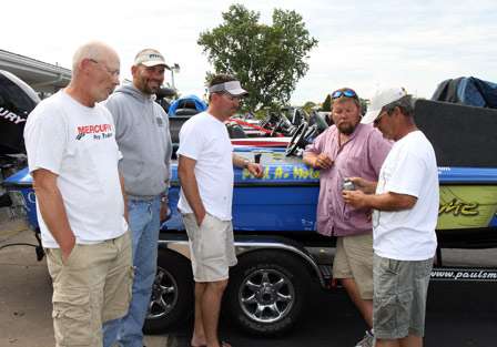 (left to right) Mike Elkins, Steve Shubert, Anthony Borkowski, Paul Molan and Bill Rea listen to a portable NOAA weather radio.