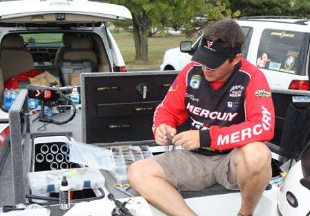 Pro Bill Byers takes advantage of his day off from competition by readying his gear for the final day.