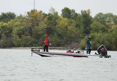 Dave Mansue and Michael McCoy work a drop off near the shore, targeting large smallmouth bass. The fishing was slow early on for most anglers.