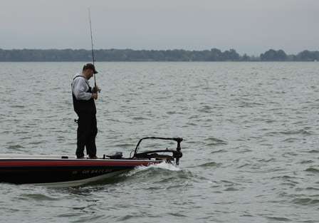 Bryan Coates fights smaller swells as he fishes offshore behind one of the islands close to Sandusky, Ohio.