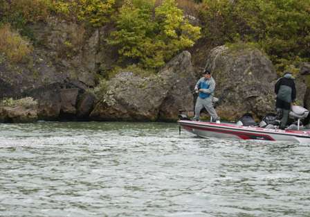 Matt Greenblatt fights a smallmouth to the side of the boat as his co-angler Ryan Johnson goes for the net.