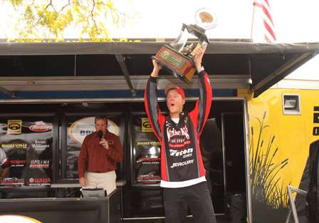 Pro Jonathon VanDam lets out a howl as he lifts the trophy over his head. He was so emotional he was practically speechless.