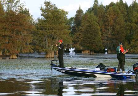 Sean Hoernke and co-angler Tommy Wheeler work slowly through the matted vegetation.