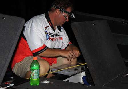 Pro Alan Rae preps a spinnerbait by adding a trailer hook to help with short striking bass that plagued many anglers on Day Two. Rae starts Day Three in eighth place in the standings.