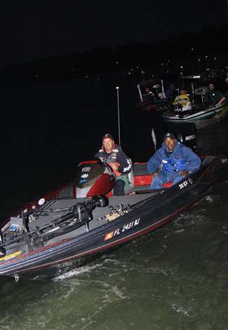 Pro Patrick Pierce and his co-angler leave the dock in third place. The competitors leave the dock in order of their standing on Day Three.