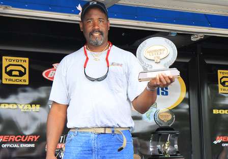 Dwaine Williams gets to holds up the hardware that came with his win on the non-boater side of the final Bassmaster Southern Open.