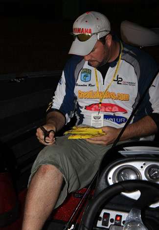 Angler Brandon Rose makes final bait choices on Day One as he waits to be launched.