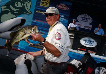 Tom Jessop, representing Texas in the Championship, holds up his kicker fish for Day One.