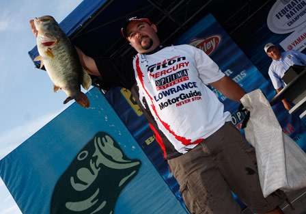 Angler Skip Sjobeck holds up a monster nine pound bass that helped him to an early lead with only two fish in the bag.
