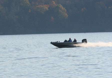 A lone boat speeds its way across the lake to make it to check-in at the Lake Dardanelle State Park.