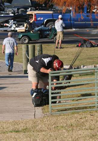 A non-boater takes a moment to adjust his tackle after getting dropped off at the docks on Day One.