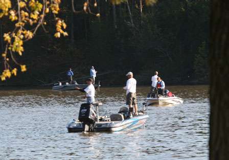Three boats spend their final minutes fishing within sight of the weigh-in area.