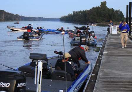 Anglers fight the current as the official launch gets under way, and the first boats pull away from the dock.