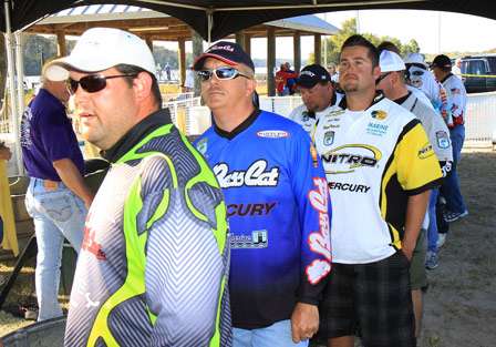 Some of the first anglers to the tanks watch to see what the average weight will be early on.